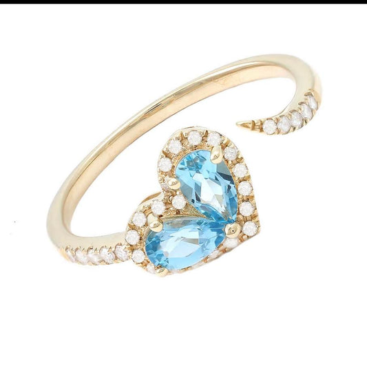 Anillo promesa con topasio azul y diamantes